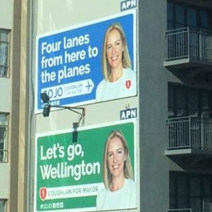 Photo of jo coughlan's mayoral bid billboards saying Four lanes to the planes and let's go wellington