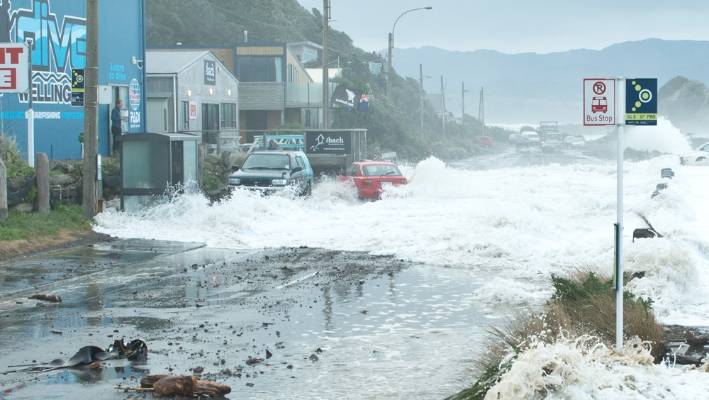 Storm surge on Wellington south coast, waves sweeping cars and utes around and smashing them into the road-front houses